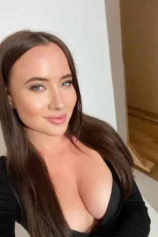 Ida taking a sexy in a black top showing off her cleavage